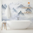 Mountain landscape wallpaper creating a peaceful atmosphere in a modern living room with minimal furniture