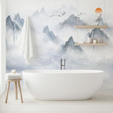 Mountain landscape wallpaper creating a peaceful atmosphere in a modern living room with minimal furniture
