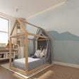 Mountain wallpaper mural in modern Scandinavian living room, showing blue peaks against white walls