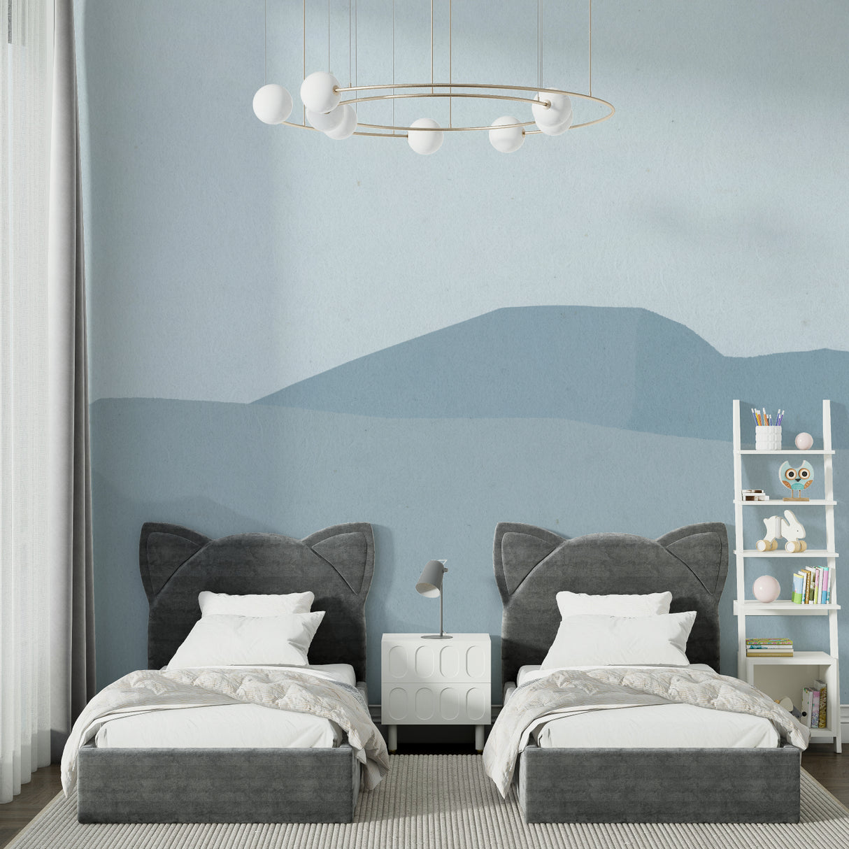 Blue mountain wall mural in child's nursery with simple furniture