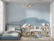Mountain mural wallpaper creating a peaceful atmosphere in a modern living room with minimal furniture