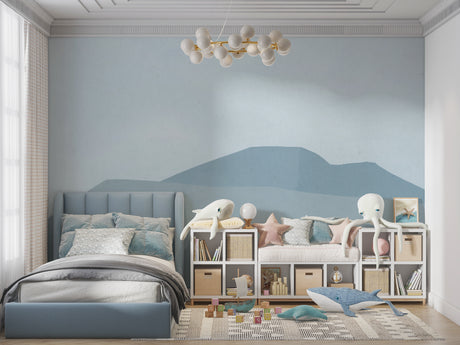 Mountain mural wallpaper creating a peaceful atmosphere in a modern living room with minimal furniture