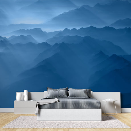 Mountain range wallpaper creating depth in modern living room with grey sofa and natural light