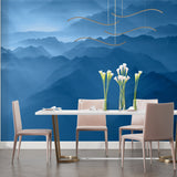 Mountain wallpaper making statement in home office with desk and chair