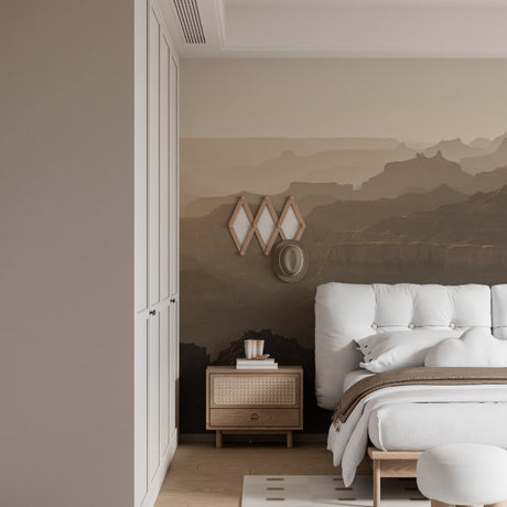 Mountain landscape wallpaper in modern living room with grey sofa and natural light