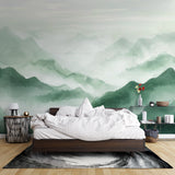 Misty mountain mural bringing serenity to a master bedroom with morning light