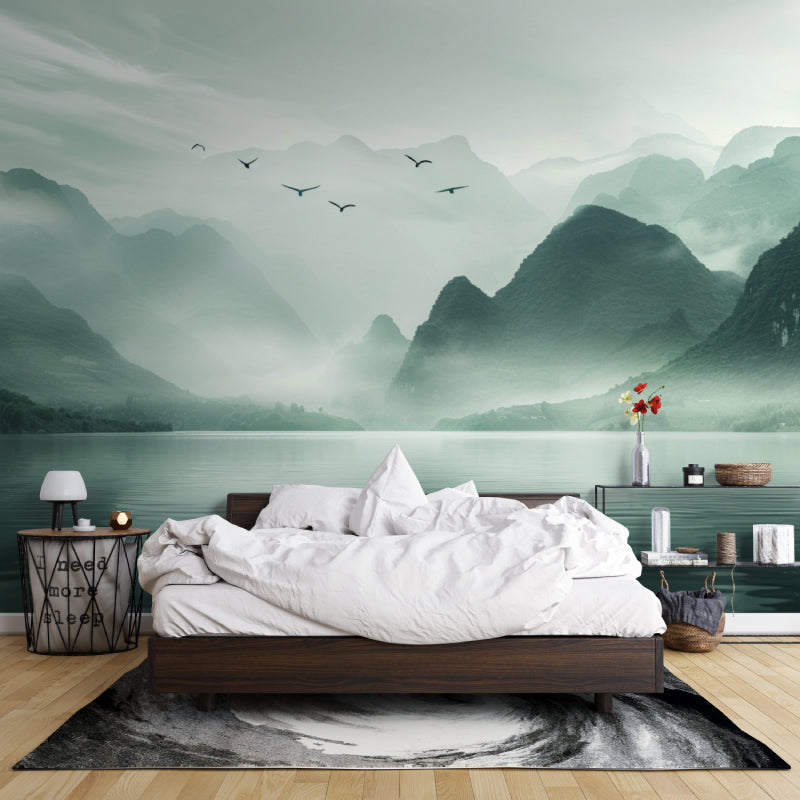 Home office with mountain scenery wallpaper showing tranquil lake reflection