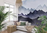 Watercolor mountain wallpaper as a stunning backdrop in a minimal bedroom setting