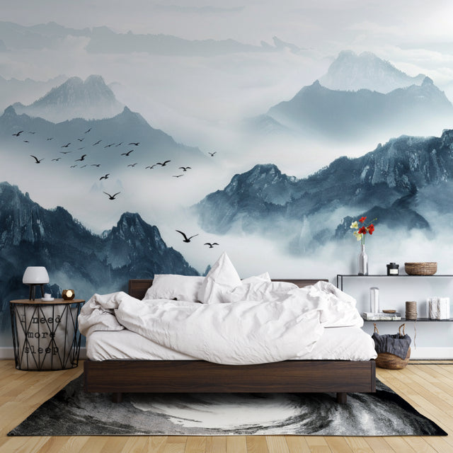 Mountain mural wallpaper creating depth in modern living room with gray sofa and natural light