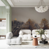 Mountain landscape wallpaper creating depth in modern living room with grey sofa and natural decor