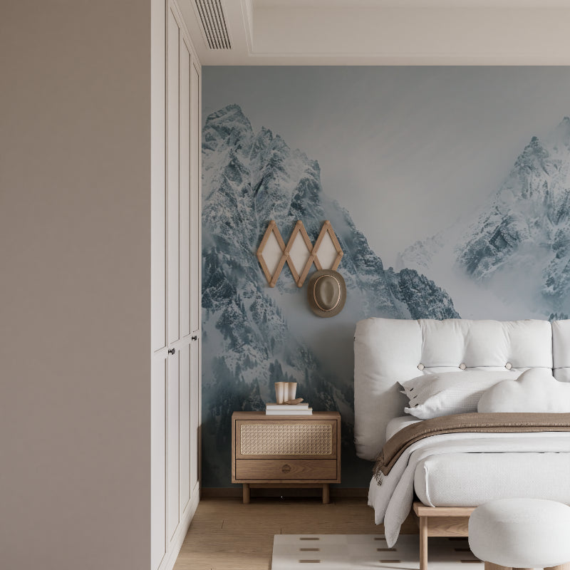 Misty peaks mural creating calm atmosphere in meditation room with floor cushions