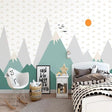 Mountain landscape wallpaper creating a serene atmosphere in a modern living room with minimal furniture