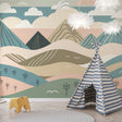 Mountain landscape wallpaper in modern living room, showing abstract pastel hills creating depth and serenity