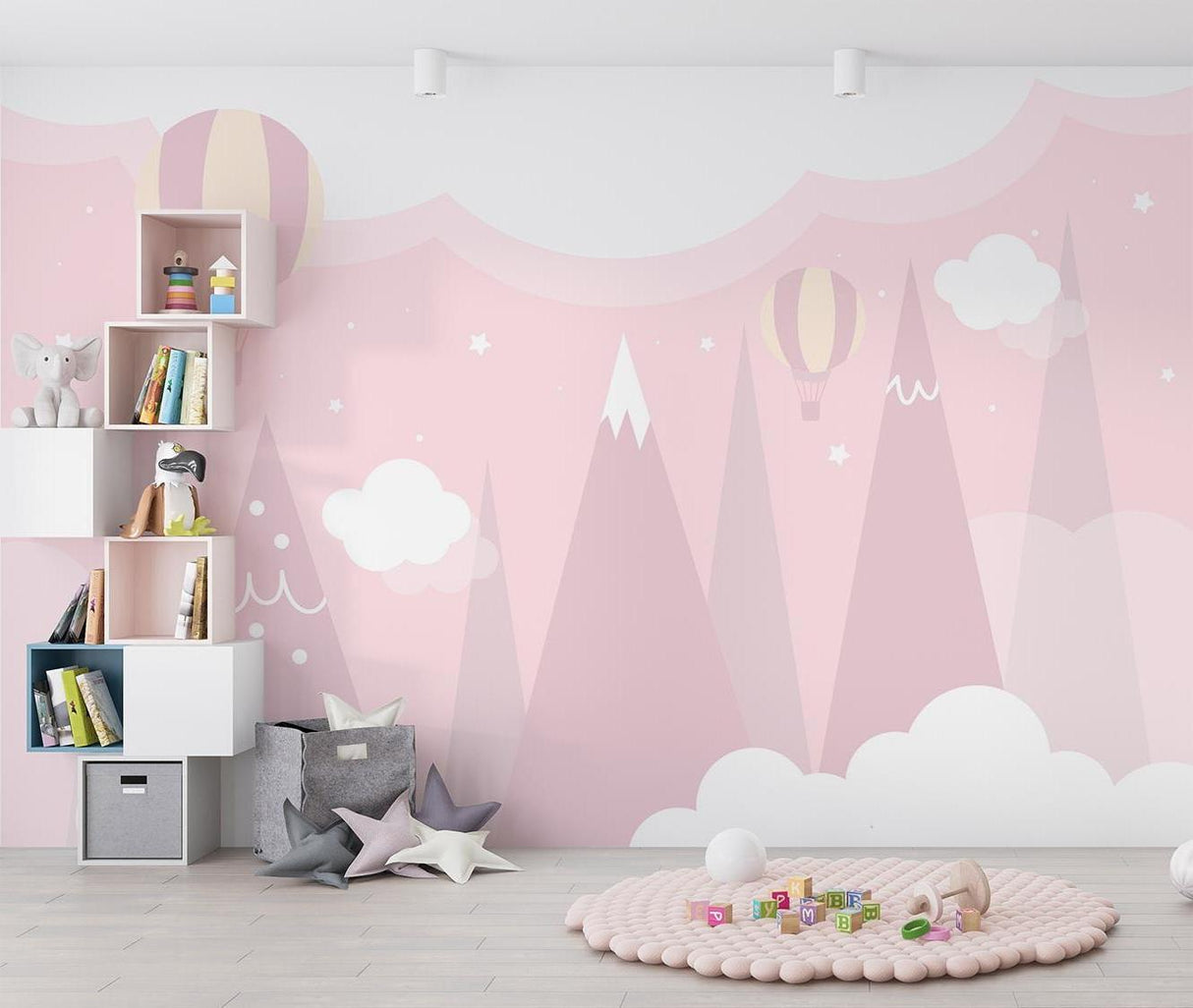 Mountain nursery wallpaper featuring pink peaks and balloons in a cozy children's bedroom setting