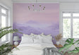 Purple Mountain Mural Wallpaper creating depth in modern living room with grey sofa and natural light