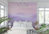 Purple Mountain Mural Wallpaper creating depth in modern living room with grey sofa and natural light
