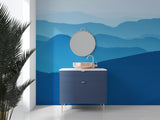 Blue mountain wallpaper in bedroom setting with minimalist furniture