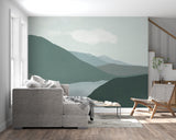 Mountain landscape wallpaper creating depth in modern living room with minimal furniture