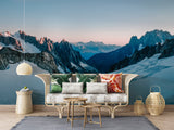 Mountain peak wallpaper in home office with wooden desk and natural decor