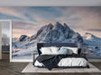 Mountain wall mural creating depth in modern living room with grey sofa and natural decor