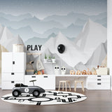 Night sky mountain wallpaper creating focal point in modern nursery