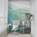 Mountain wall mural in dining room showcasing gradient green tones and abstract peaks