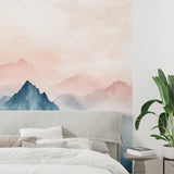 Mountain peak wallpaper creating a focal point in a home office with morning light