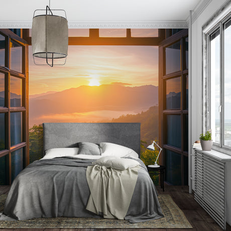 Mountain sunset mural wallpaper creating depth in modern living room with grey sofa