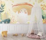 Children's reading corner with enchanted forest wallpaper and soft seating