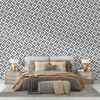 3D speaker wallpaper creating depth in a modern living room with black furniture and ambient lighting