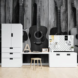 Music wallpaper featuring guitars in dining room, adding artistic black and white charm