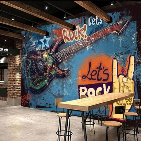 Rock and roll graffiti wallpaper creating urban atmosphere in a modern teen bedroom with blue and orange tones