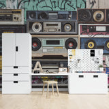 Teen bedroom decorated with retro music wallpaper showing classic boomboxes