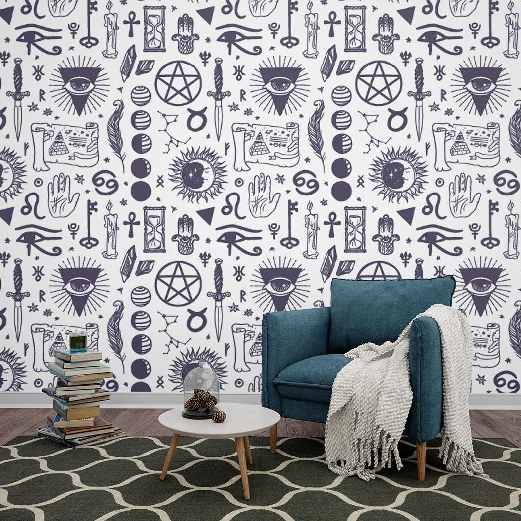 Black and white mystical symbols wallpaper in a modern living room setting