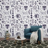Black and white mystical symbols wallpaper in a modern living room setting