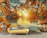 Autumn lake sunset wallpaper mural in a modern living room creating a peaceful atmosphere with golden light reflections