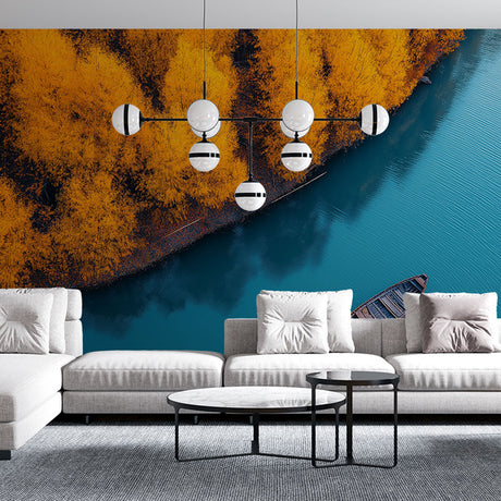 Autumn lake wallpaper mural creating depth in modern living room with orange and blue tones reflecting natural light