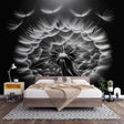 Black and white dandelion wall mural creating drama in a minimalist living room with modern furniture