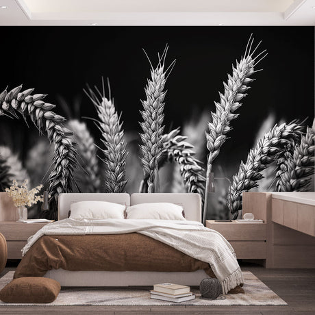 Black and white wheat field wallpaper creating dramatic contrast in a modern dining room with natural lighting