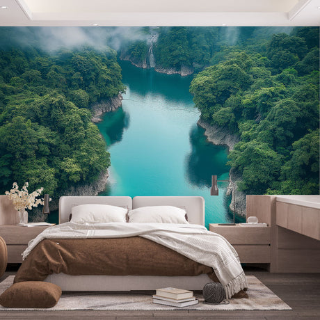 Turquoise river landscape wallpaper creating depth in modern living room with natural light and minimal furniture