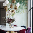 Botanical wallpaper with watercolor leaves creating a calm atmosphere in a modern living room