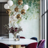 Botanical wallpaper with watercolor leaves creating a calm atmosphere in a modern living room