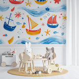 Sailing boats wallpaper creating a playful atmosphere in a modern nursery with natural light
