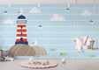 Nautical lighthouse wallpaper creating a cozy atmosphere in a bright kids bedroom with white furniture