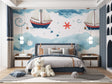 Nautical wallpaper with sailing ships in a bright, modern nursery showing the perfect scale of the design
