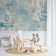 Nautical wallpaper with vintage ships in a cozy nursery setting, soft blue-grey tones create a peaceful atmosphere