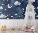 Moon and stars wallpaper adding wonder to a reading nook with gentle lighting
