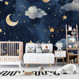 Starry night mural bringing calm to a children's bedroom with golden accents