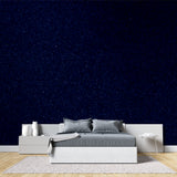 Glitter star wallpaper featured in a teen's bedroom with fairy lights