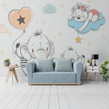 Nursery animal wallpaper with elephants and bears shown in a bright modern nursery with white furniture